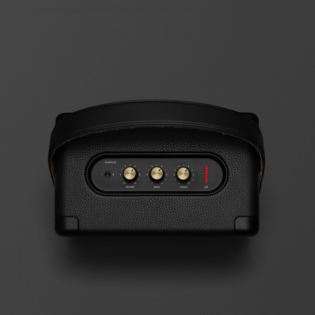 The Marshall Kilburn II Black and Brass is a portable speaker in black with a red button on it.