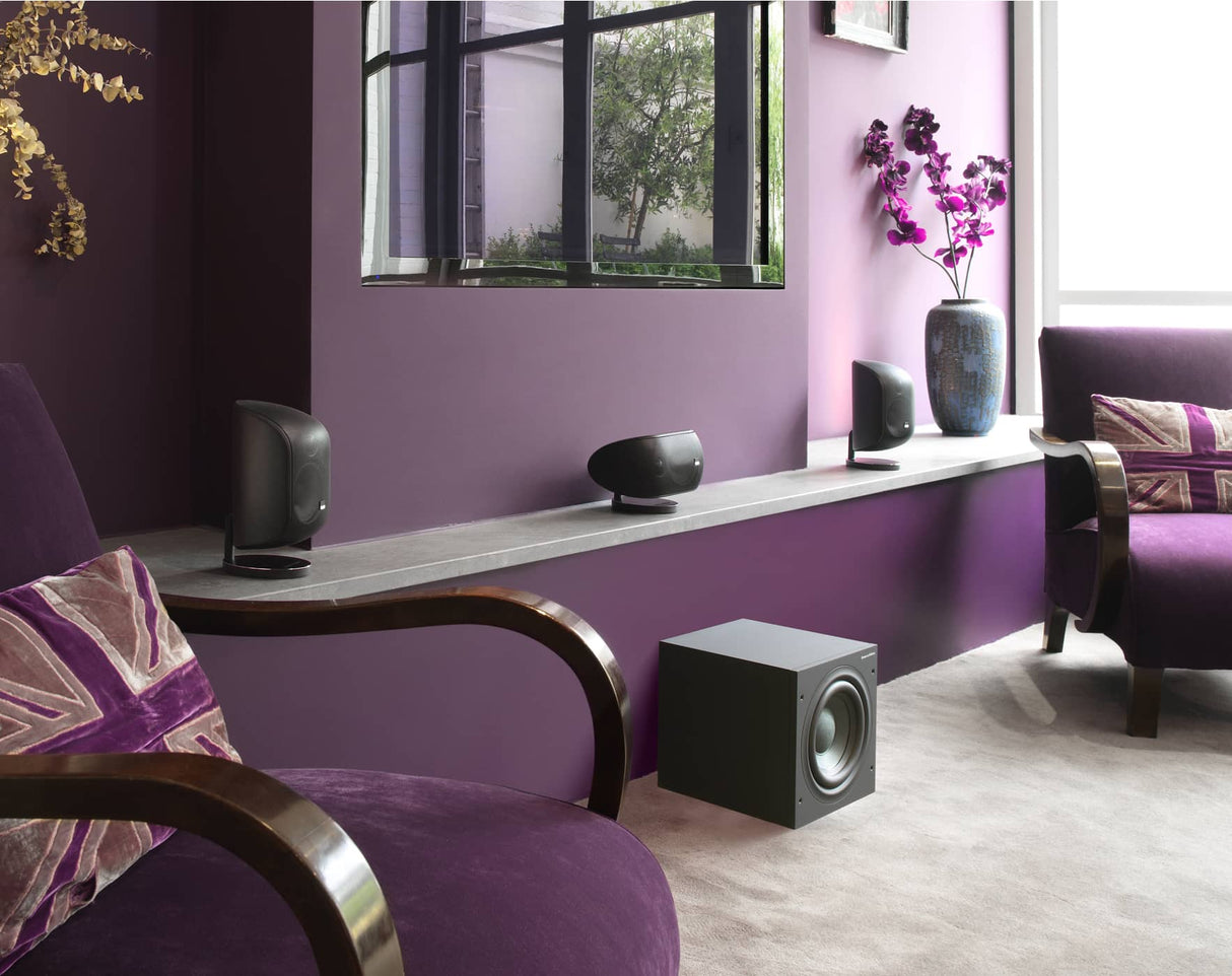 Bowers & Wilkins M-1 satellite speakers as part of a home theater setup