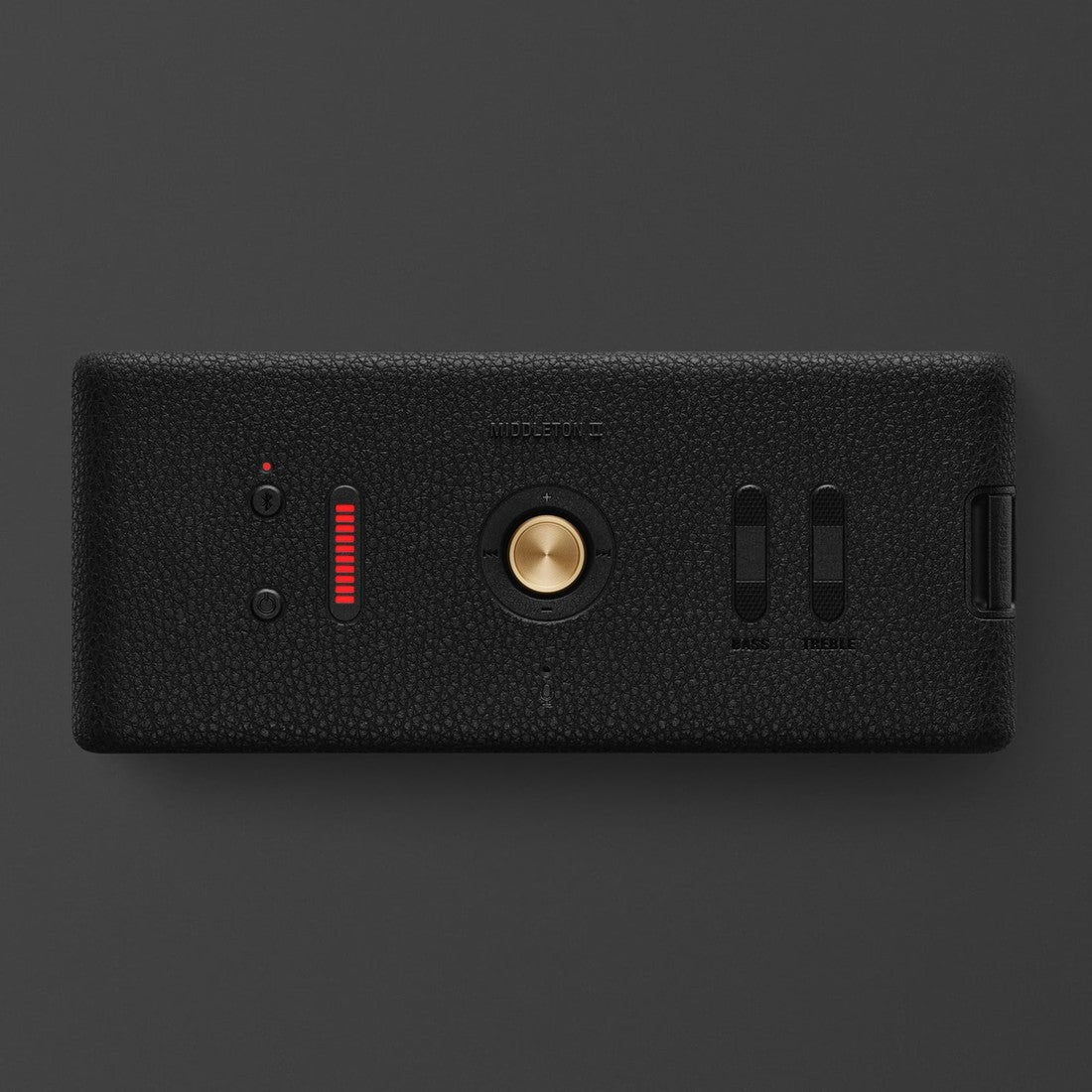 Marshall Middleton II Black and Brass, a stylish black rectangular Bluetooth speaker with a gold button, red indicator, two sliders, and USB port, is shown on a dark background.