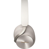 A pair of Technics over-ear headphones in a brushed silver metallic finish, featuring a white headband and a gold logo on the ear cup, set against a plain white background.