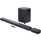 Black JBL Bar 700 soundbar with wireless subwoofer, detachable surround speakers, and remote, on a white background