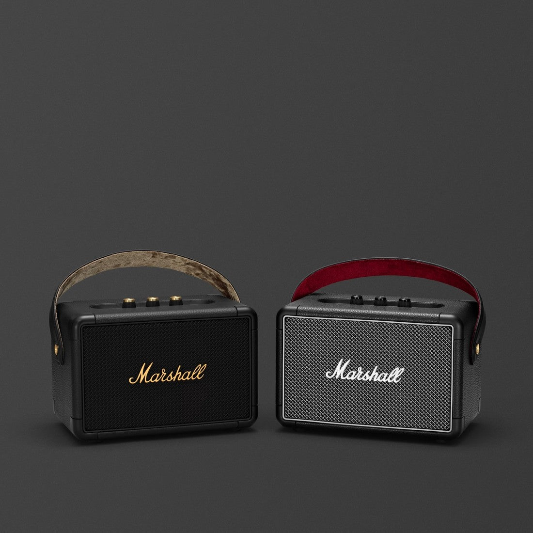 Two portable Marshall KILBURN II Bluetooth speakers on a grey background.