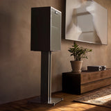 Klipsch Rebellion BK beside modern media console