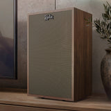 Klipsch Rebellion WN beside TV and plant