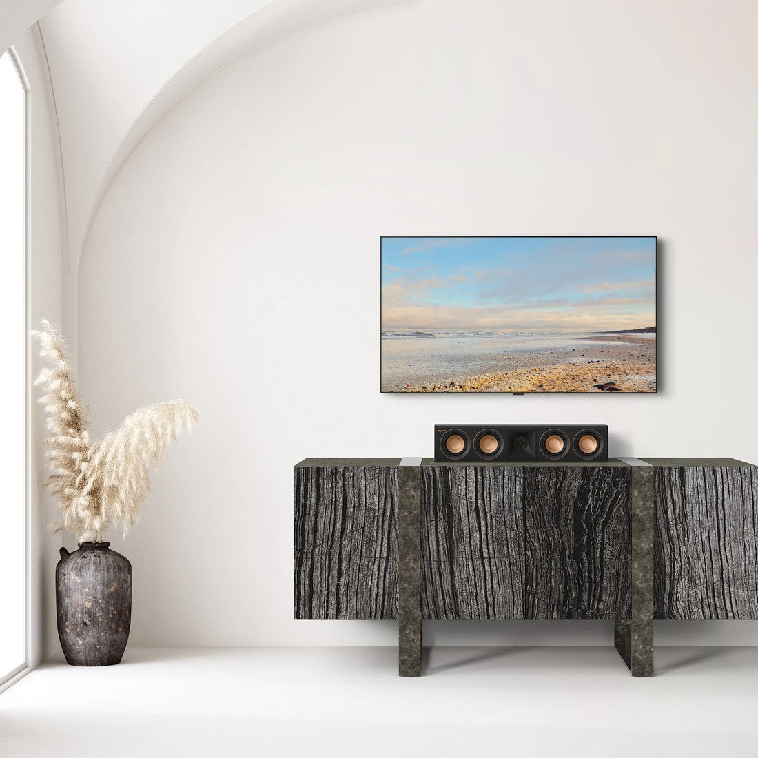 Modern living room with a TV mounted on the wall above a console table.