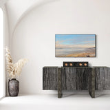 Modern living room with a TV mounted on the wall above a console table.