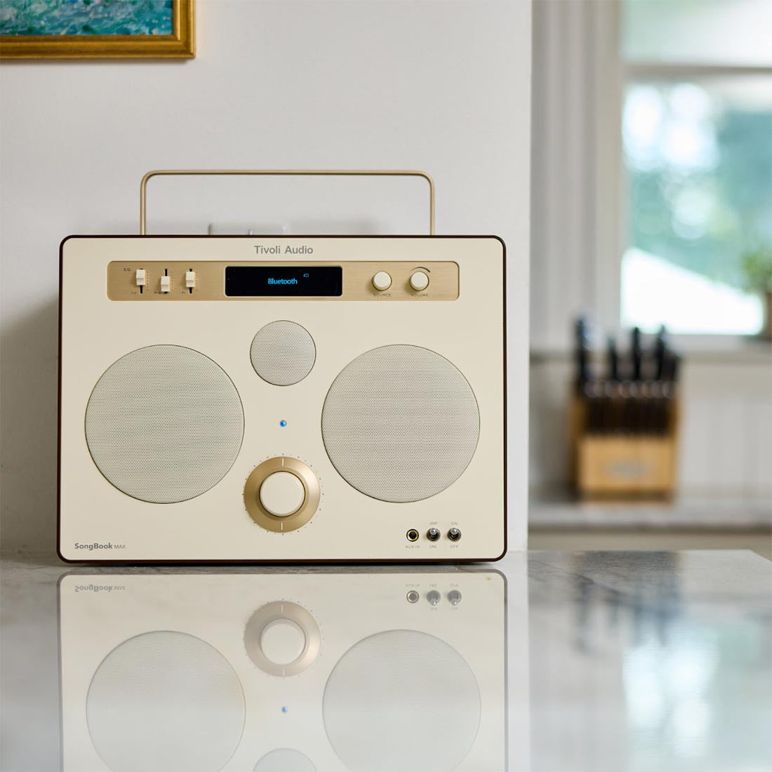 Cream and Brown Tivoli SongBook MAX speaker on kitchen counter