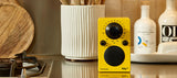 A yellow Tivoli PAL BT on a kitchen counter